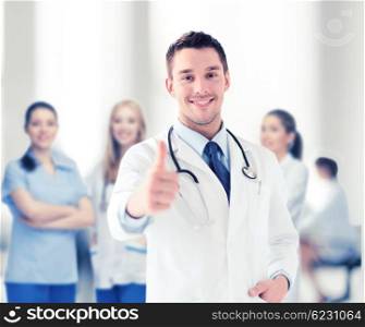 healthcare and medical concept - doctor with stethoscope showing thumbs up. doctor with stethoscope showing thumbs up