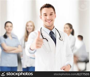 healthcare and medical concept - doctor with stethoscope showing thumbs up
