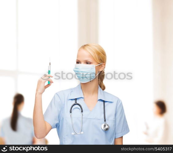 healthcare and medical concept - female doctor or nurse in medical mask holding syringe with injection