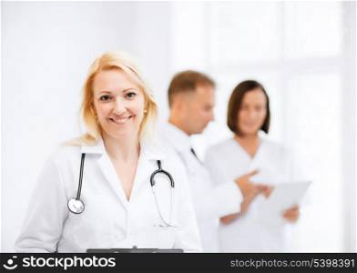 healthcare and medical concept - female doctor with stethoscope