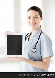 healthcare and medical concept - female doctor with tablet pc