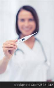 healthcare and medical concept - female doctor with thermometer and stethoscope. doctor with thermometer and stethoscope