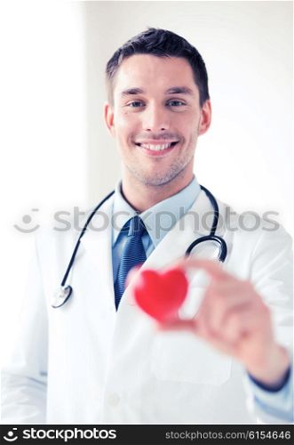 healthcare and medical concept - male doctor with heart. male doctor with heart
