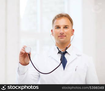 healthcare and medical concept - male doctor with stethoscope