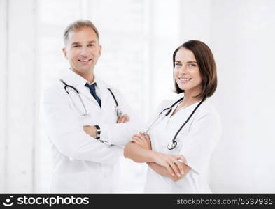 healthcare and medical concept - picture of two young attractive doctors