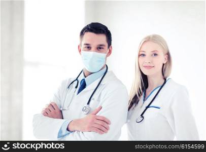 healthcare and medical concept - picture of two young attractive doctors. two young attractive doctors
