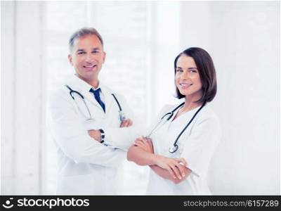 healthcare and medical concept - picture of two young attractive doctors. two young attractive doctors