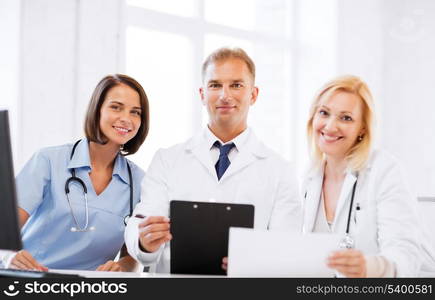 healthcare and medical concept - team or group of doctors on meeting