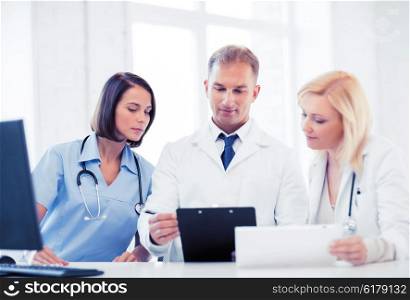 healthcare and medical concept - team or group of doctors on meeting. team or group of doctors on meeting