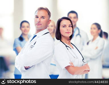 healthcare and medical concept - two doctors with stethoscopes. two doctors with stethoscopes