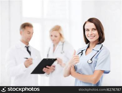 healthcare and medical concept - young female doctor with stethoscope