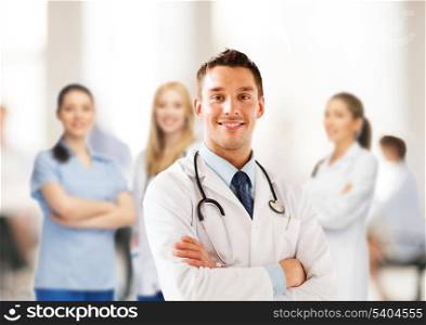 healthcare and medical concept - young male doctor with stethoscope