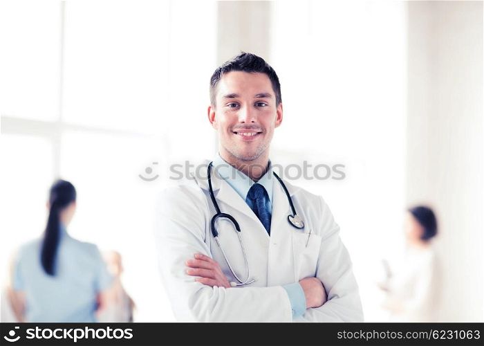 healthcare and medical concept - young male doctor with stethoscope. young male doctor with stethoscope