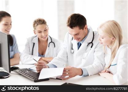 healthcare and medical concept - young team or group of doctors on meeting