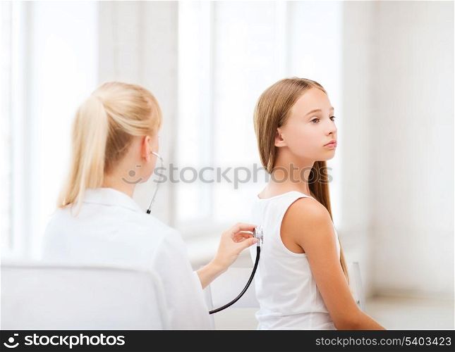 healthcare and medical - doctor with stethoscope listening to child back in hospital
