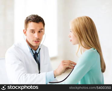 healthcare and medical - doctor with stethoscope listening to the patient in hospital