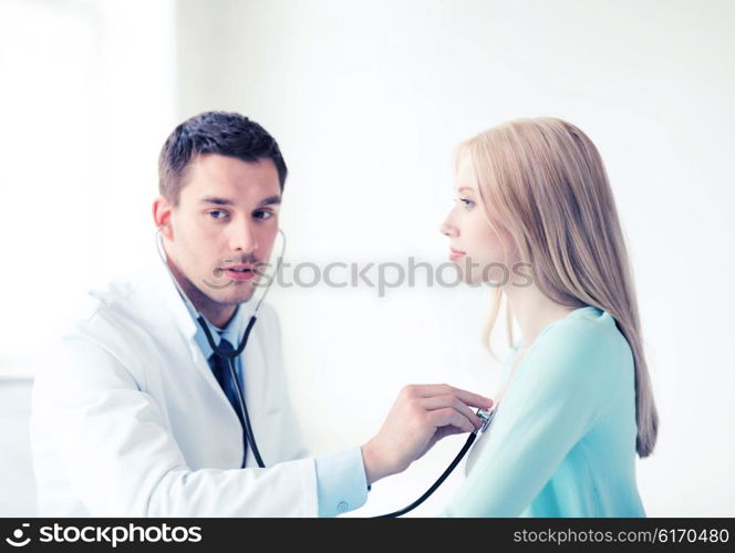 healthcare and medical - doctor with stethoscope listening to the patient in hospital. doctor with stethoscope listening to the patient