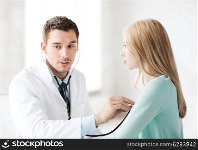healthcare and medical - doctor with stethoscope listening to the patient in hospital