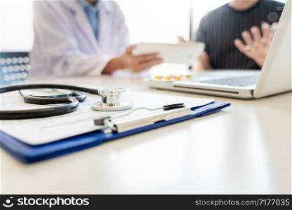 healthcare and medical ethics concept, doctor explains prescription to victim diagnosis giving a consultation and Patient listening intently in hospital