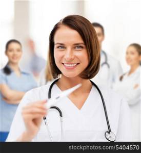 healthcare and medical - female doctor with thermometer and stethoscope