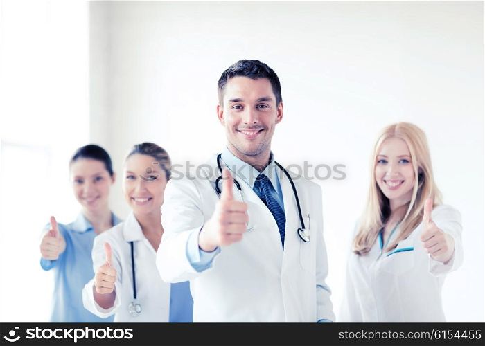 healthcare and medical - professional young team or group of doctors showing thumbs up. professional young team or group of doctors