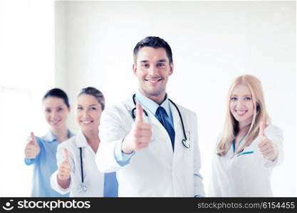 healthcare and medical - professional young team or group of doctors showing thumbs up. professional young team or group of doctors