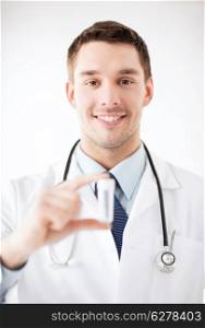 healthcare and medical - young male doctor with empty test-tube
