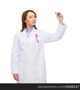 healthcare and medicine concept - female doctor with pink breast cancer awareness ribbon writing something in the air