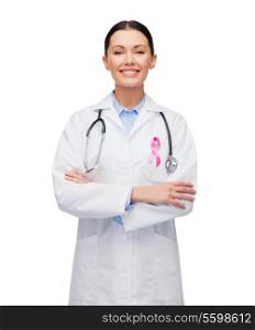 healthcare and medicine concept - female doctor with pink breast cancer awareness ribbon