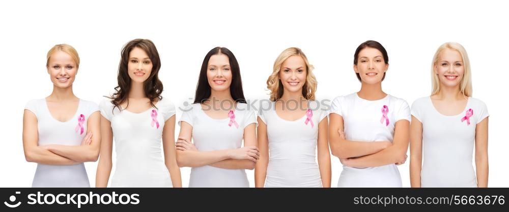 healthcare and medicine concept - group of smiling women in blank t-shirts with pink breast cancer awareness ribbons