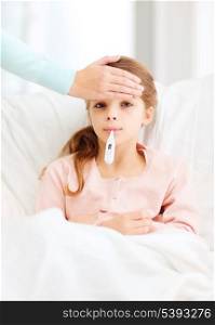 healthcare and medicine concept - ill girl child with thermometer in mouth and caring mother