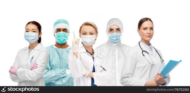 healthcare and medicine concept - international team of doctors and scientists wearing face protective medical mask for protection from virus disease over white background. team of doctors and scientists in medical masks