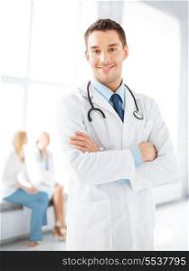 healthcare and medicine concept - male doctor with stethoscope