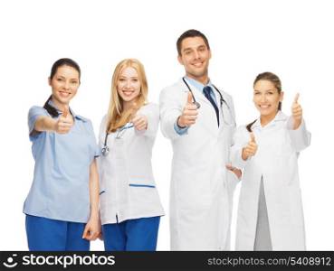 healthcare and medicine concept - professional young team or group of doctors showing thumbs up