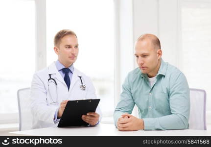 healthcare and medicine concept - serious doctor with clipboard and patient in hospital