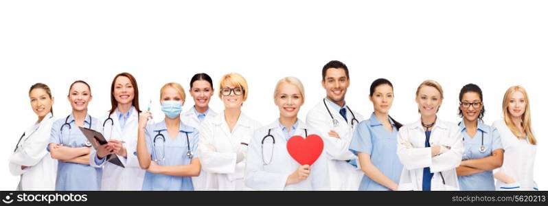 healthcare and medicine concept - smiling doctors and nurses with red heart