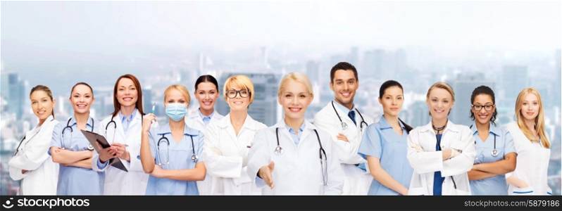 healthcare and medicine concept - smiling doctors and nurses with stethoscope. smiling female doctors and nurses with stethoscope