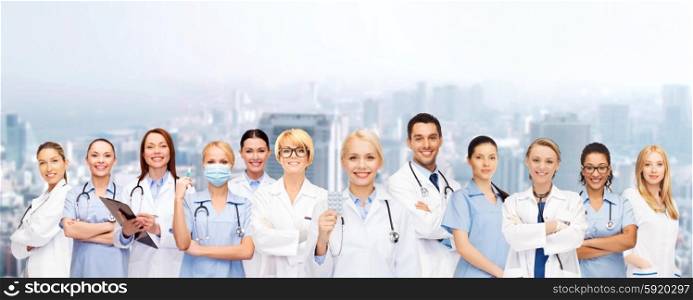 healthcare and medicine concept - smiling doctors and nurses with stethoscope. smiling doctors and nurses with stethoscope