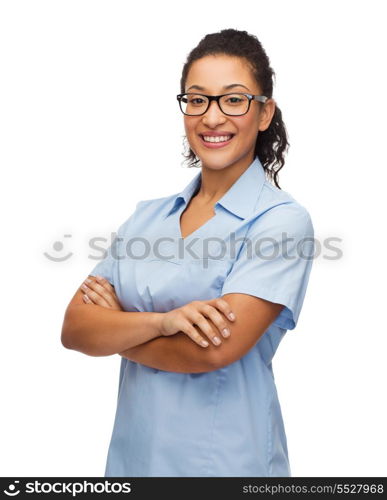 healthcare and medicine concept - smiling female african american doctor or nurse in eyeglasses with crossed arms