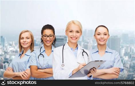 healthcare and medicine concept - smiling female doctor and nurses with stethoscope