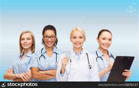healthcare and medicine concept - smiling female doctor and nurses with stethoscope. smiling female doctor and nurses with stethoscope