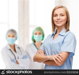 healthcare and medicine concept - smiling female doctor or nurse