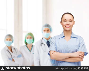 healthcare and medicine concept - smiling female doctor or nurse