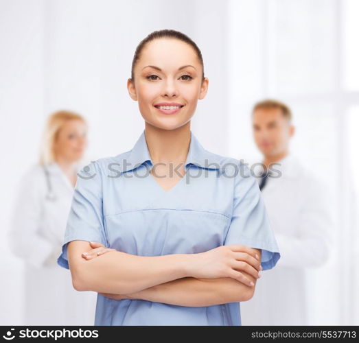 healthcare and medicine concept - smiling female doctor or nurse