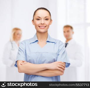 healthcare and medicine concept - smiling female doctor or nurse