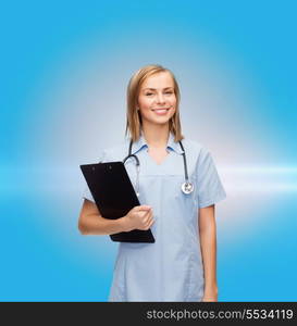 healthcare and medicine concept - smiling female doctor or nurse with clipboard and stethoscope