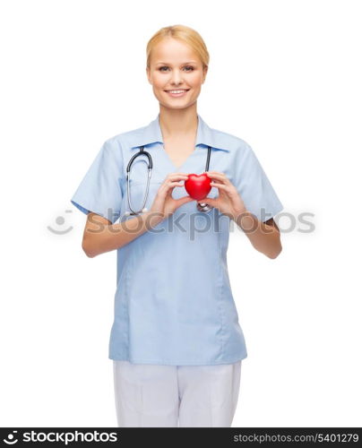 healthcare and medicine concept - smiling female doctor or nurse with heart and stethoscope