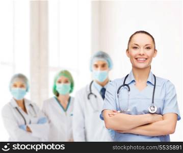 healthcare and medicine concept - smiling female doctor or nurse with stethoscope