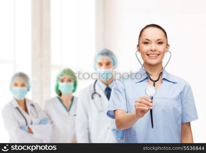 healthcare and medicine concept - smiling female doctor or nurse with stethoscope