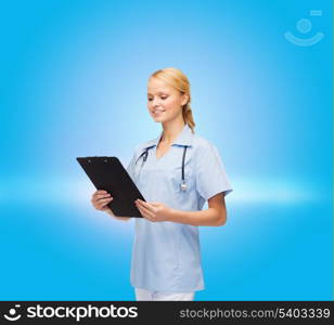healthcare and medicine concept - smiling female doctor or nurse with stethoscope and clipboard